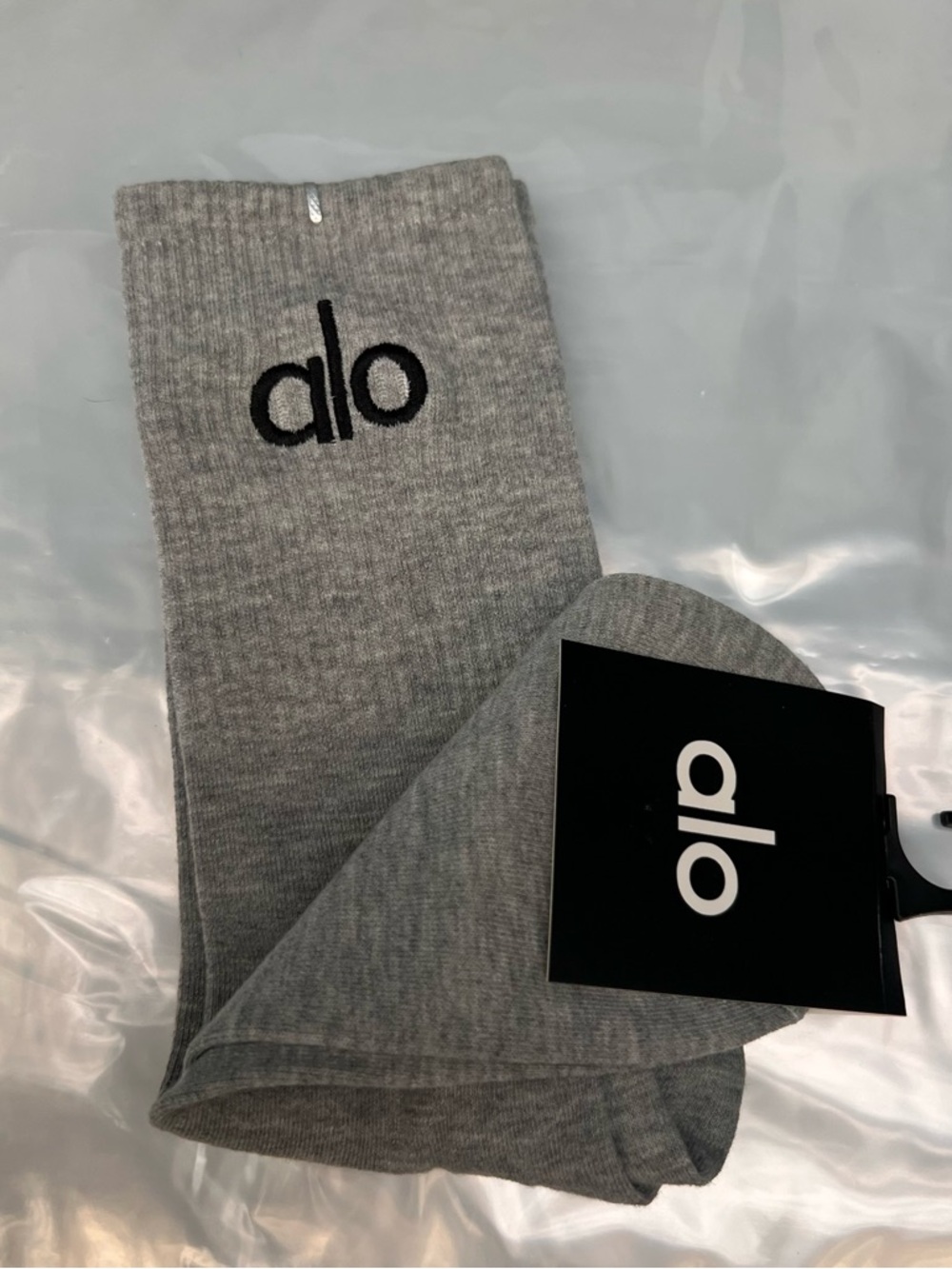 ALO Yoga unisex half crew understated socks in gray embroidered logo